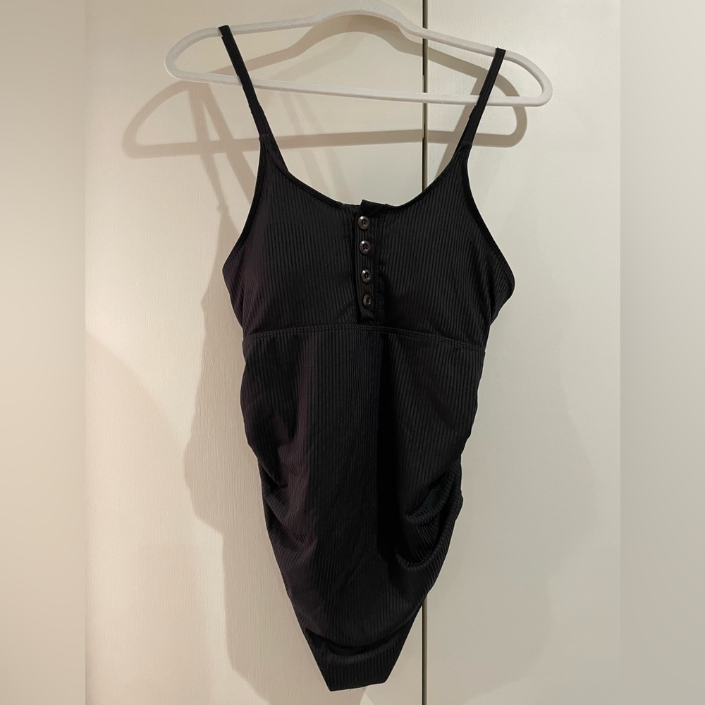 Summer Mae black maternity ribbed one piece swimsuit with button detail.